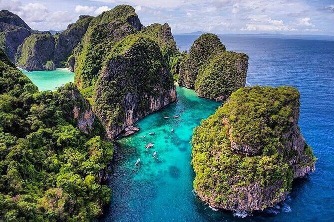 Private Phi Phi and Khai Islands Snorkeling Tour by Speedboat - Viking Cave: wall art above, snorkeling below